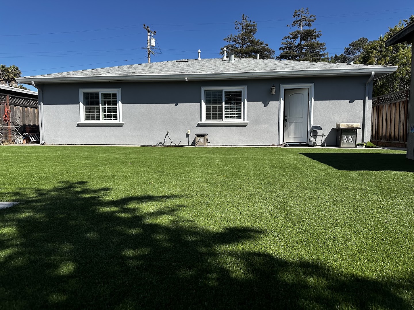 Artificial turf lawn installed by PaveMasters behind a San Jose home